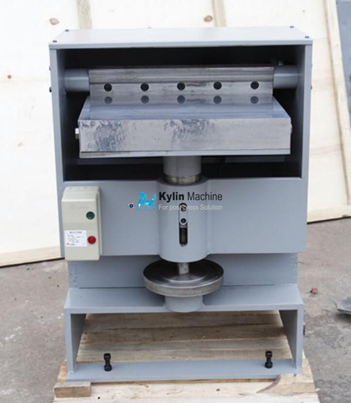 Book spine rounding and backing machine